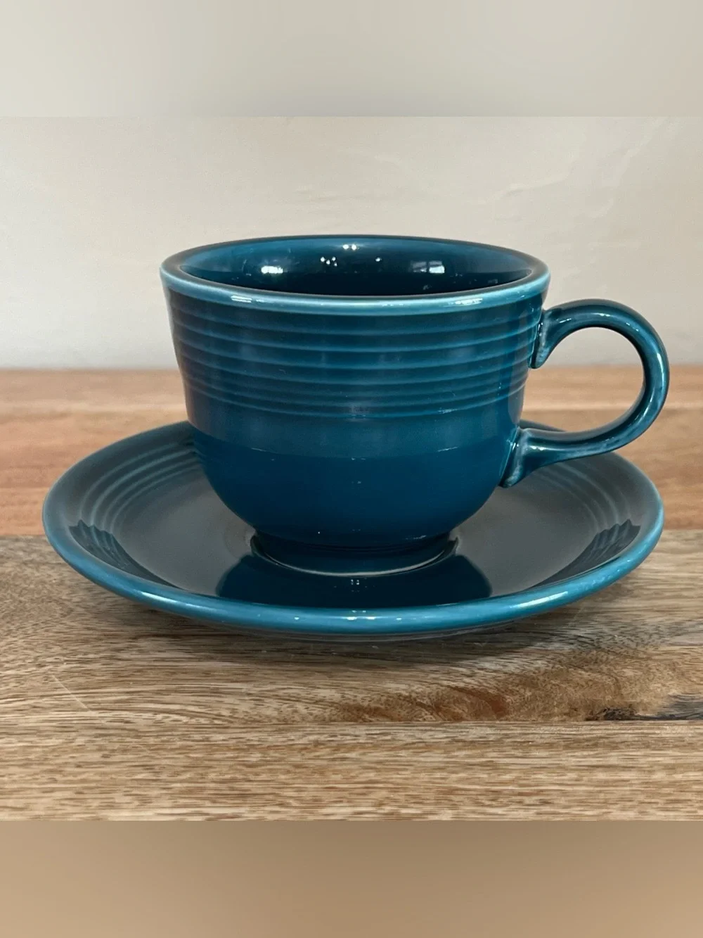 Fiesta tea cup and saucer set in the retired Juniper green color year stamp 2000